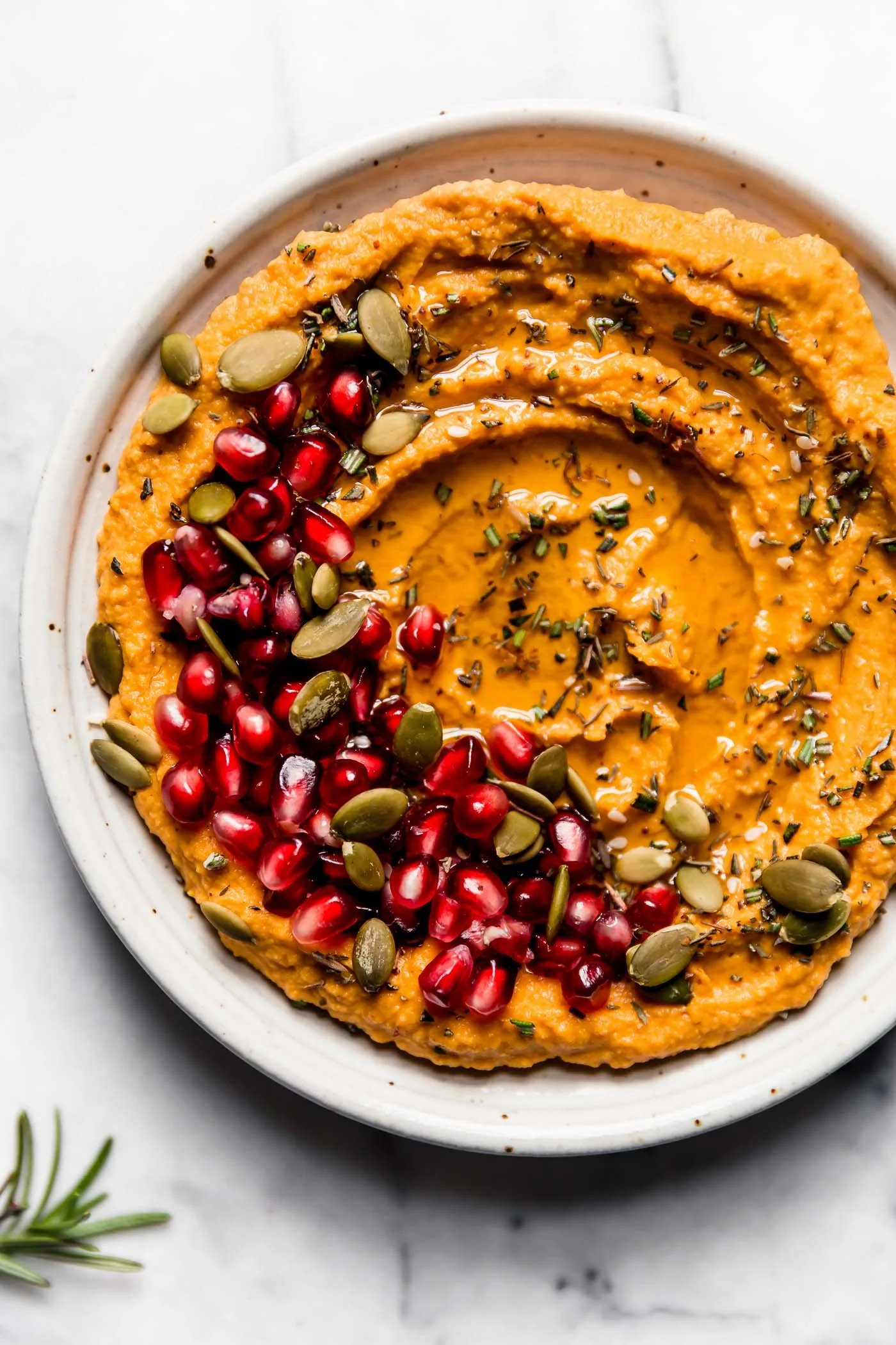 10-Minute Cozy and Creamy Pumpkin Hummus served in a bowl