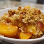 Delicious peach crisp made with fresh peaches and a crunchy topping