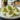 Avocado deviled eggs topped with paprika on a serving platter