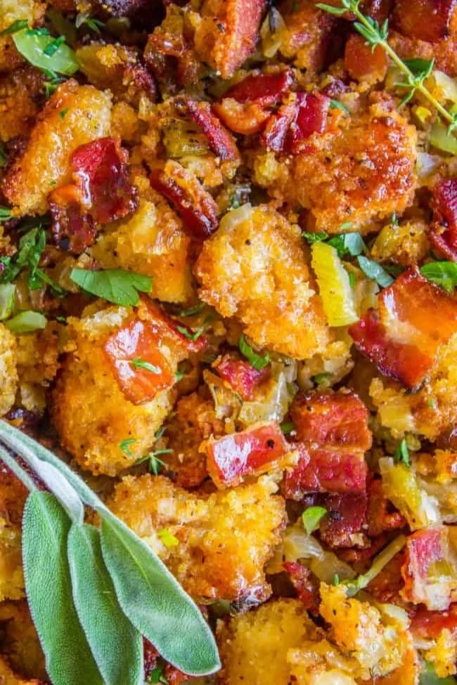 Delicious bacon cornbread stuffing in a baking dish, perfect for Thanksgiving.