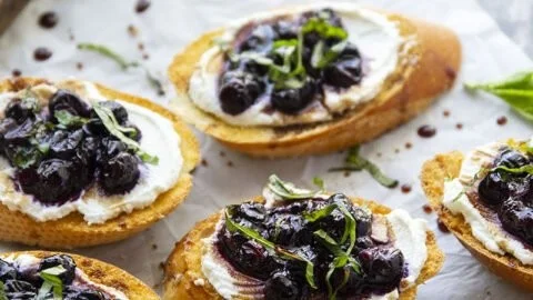 Delicious Basil Blueberry Bruschetta topped with ricotta cheese