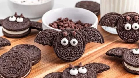 Homemade Bat Oreos decorated for Halloween with chocolate and sprinkles