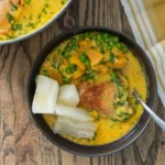 Braised chicken with yellow chile and coconut milk served on a plate