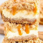 Delicious caramel apple cheesecake bars topped with caramel drizzle