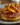 Delicious caramel peach upside-down pancakes served with fresh peaches and syrup.