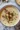 Bowl of creamy cauliflower potato soup garnished with herbs