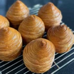 Golden, flaky croissant freshly baked by Chef Broich