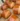 Golden brown croissant freshly baked, showcasing flaky layers and pastry perfection.