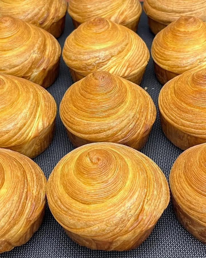 Freshly baked croissant by Chef Broich, showcasing layers of buttery pastry.