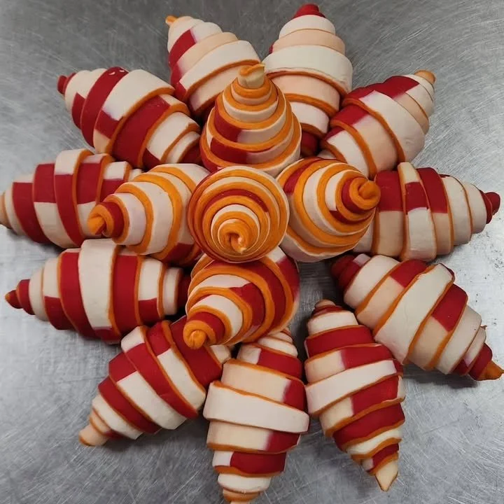 Deliciously golden croissant pastry expertly crafted by Chef Broich.