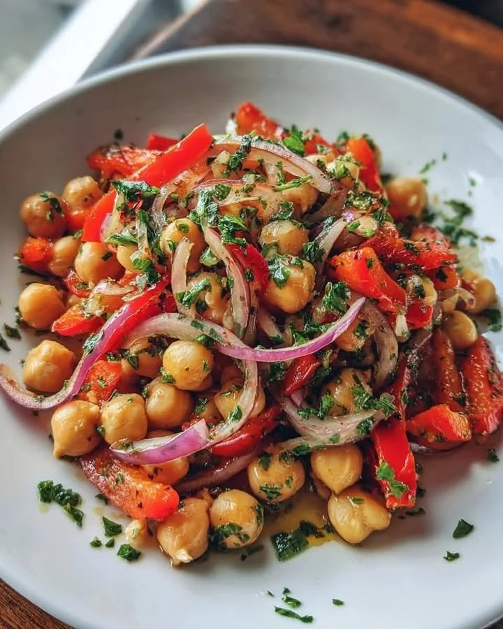 Chickpea and roasted pepper salad in a colorful bowl