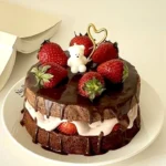 Chocolate Strawberry Layer Cake featuring rich layers and white cream filling