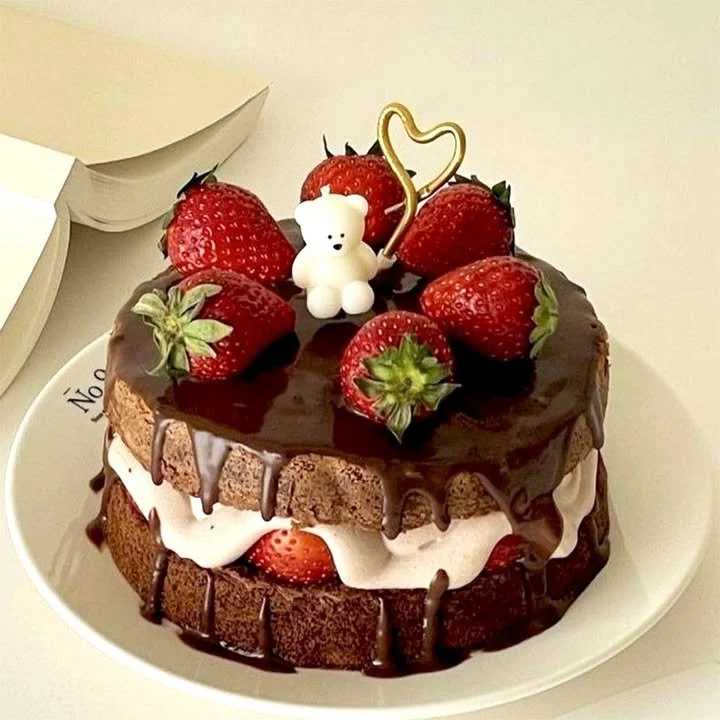 Chocolate Strawberry Layer Cake featuring rich layers and white cream filling