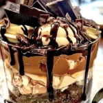 Delicious chocolate trifle with layers of mousse and cake