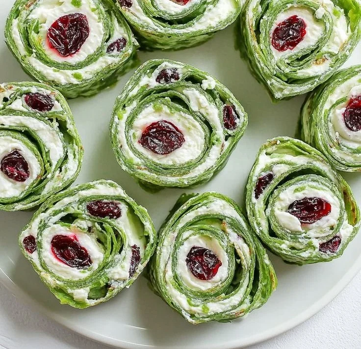 Delicious Christmas Cranberry Pinwheels served on a festive platter.