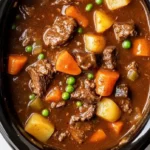 Delicious crockpot beef stew simmering with vegetables and spices.