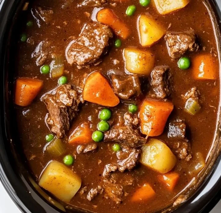 Delicious crockpot beef stew simmering with vegetables and spices.