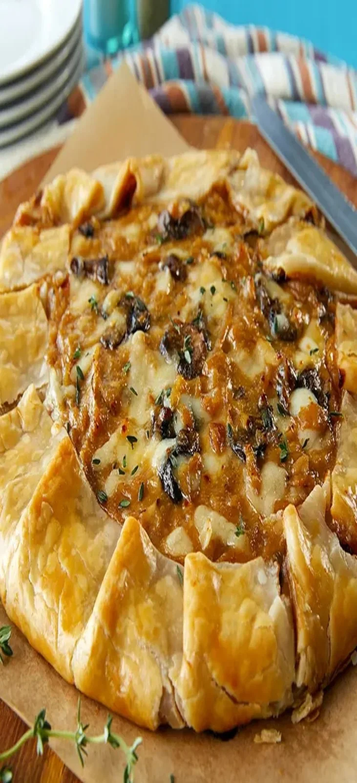 Delicious French onion crostata with mushrooms served on a plate.