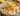 Deliciously creamy corn dip served in a bowl with tortilla chips.