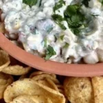 Delicious Crack Corn Dip recipe served in a bowl with tortilla chips.