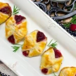 Delicious cranberry brie bites served on a platter for a festive occasion