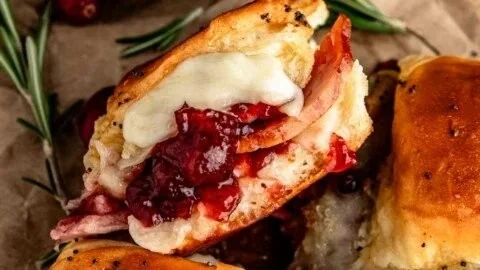Cranberry Turkey Sliders served on a platter with fresh garnishes