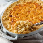 Creamy baked macaroni and cheese in a dish with a golden, cheesy crust