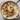 Creamy cauliflower potato soup in a bowl with fresh herbs