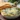 Creamy spinach artichoke dip served in a bowl with tortilla chips