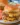Slow-cooked Crockpot Cheeseburgers served on a plate with toppings