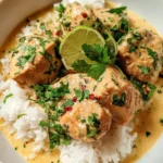 Delicious Crockpot Coconut Lime Chicken served with fresh lime slices and herbs.