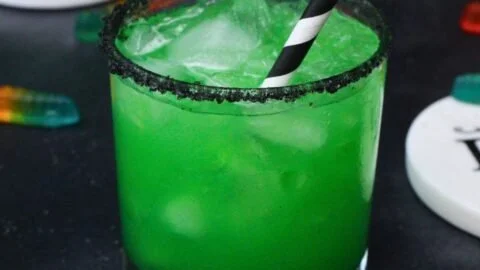 Colorful Beetlejuice Cocktail with vodka, ideal for Halloween parties.