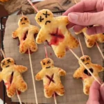 Easy puff pastry voodoo dolls with honey fake blood for Halloween treats