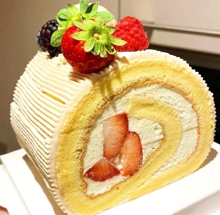 Delicious easy vanilla cake roll dessert on a plate