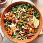 A colorful Fall Harvest Salad with seasonal ingredients like cranberries, nuts, and mixed greens.