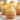 Fluffy orange cupcakes topped with orange frosting and zest.