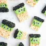 Frankenstein Halloween Rice Krispie Treats decorated with green icing