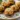 Plate of garlic parmesan stuffed mushrooms ready to serve as appetizers