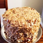 Deliciously moist German Chocolate Pound Cake topped with chocolate and pecans