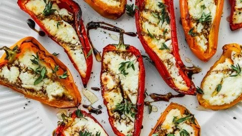 Goat cheese stuffed mini peppers on a serving platter
