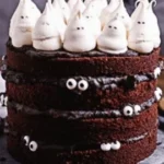 Halloween Cake decorated with spooky themes, inspired by The Spirits I Summoned.
