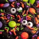 An assortment of Halloween Cookies decorated with spooky designs.