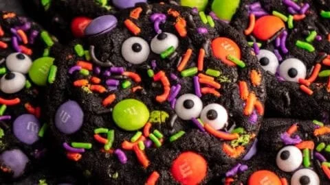 An assortment of Halloween Cookies decorated with spooky designs.