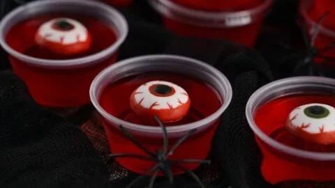 Halloween eyeball jello shots served in clear cups