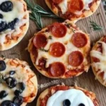 Halloween-themed mini pizzas with spooky toppings for a festive celebration