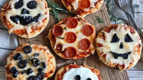 Spooky Halloween Mini Pizzas with festive toppings for a fun party snack