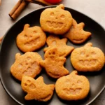 Vegan Halloween pumpkin spice cookies topped with seasonal spice decorations