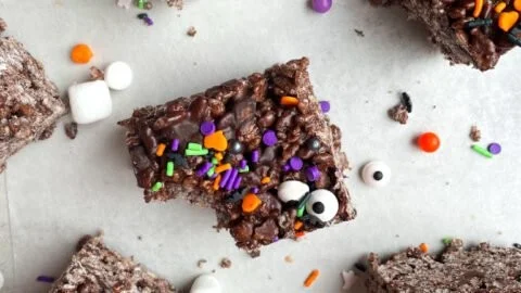 Colorful Halloween Rice Krispie Treats shaped like pumpkins and ghosts