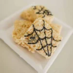 Colorful Halloween Rice Krispie Treats decorated with spooky designs
