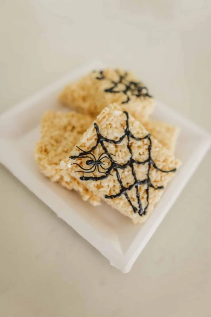Colorful Halloween Rice Krispie Treats decorated with spooky designs